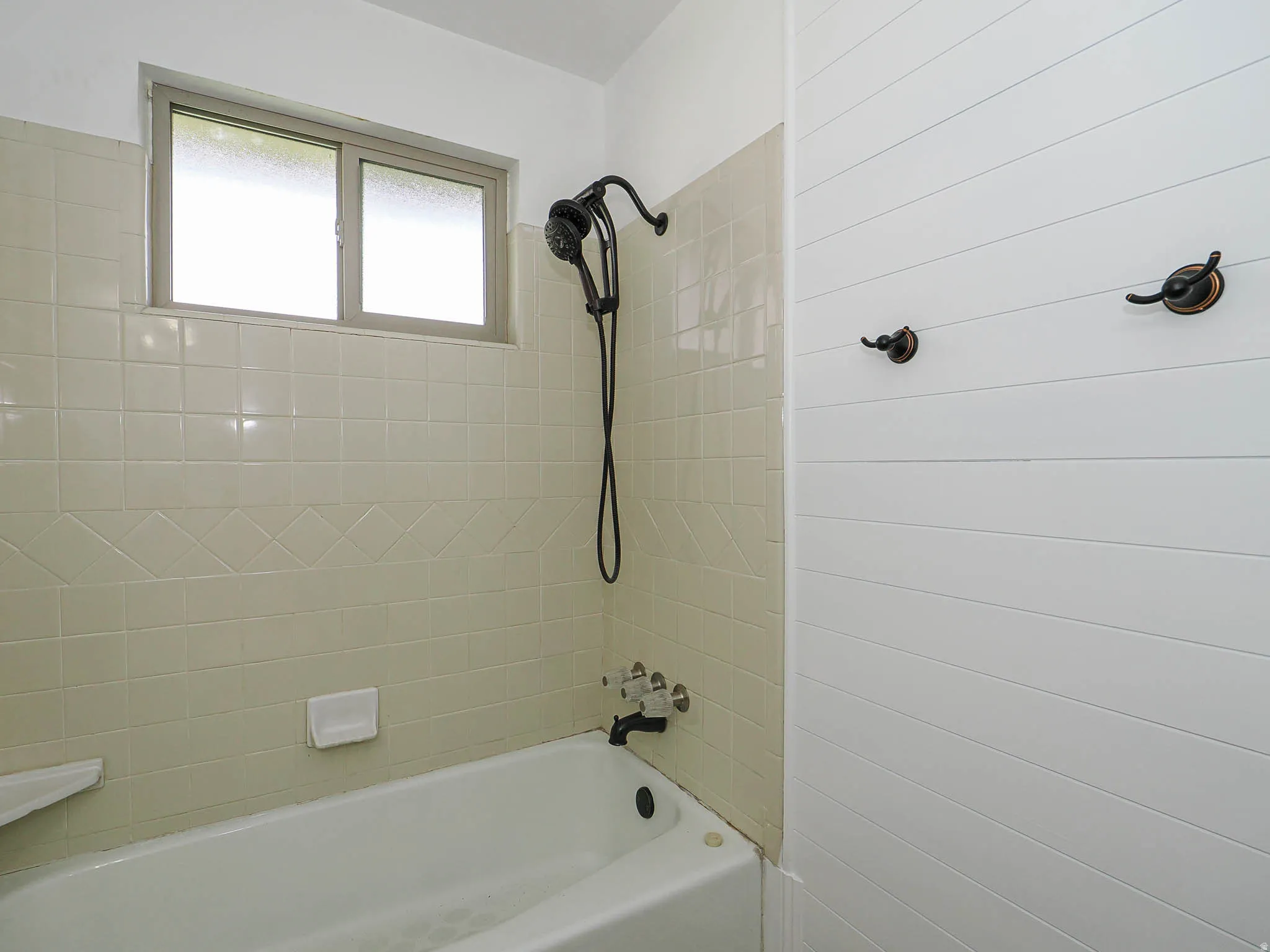 Full bath featuring shower / tub combination