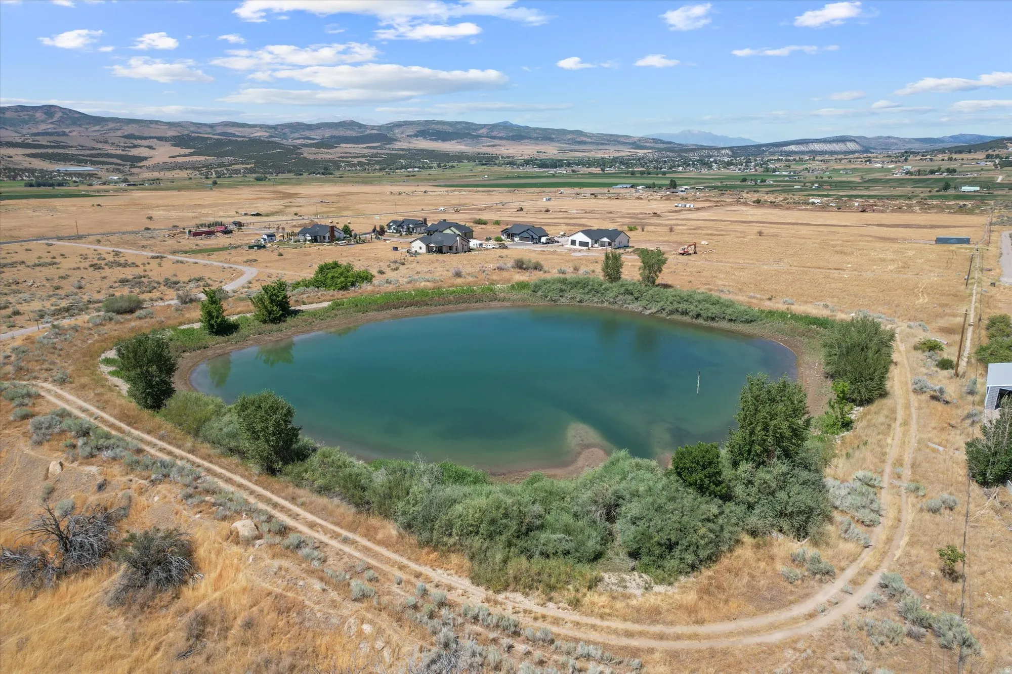 View of property location featuring rural landscape and a water and mountain view