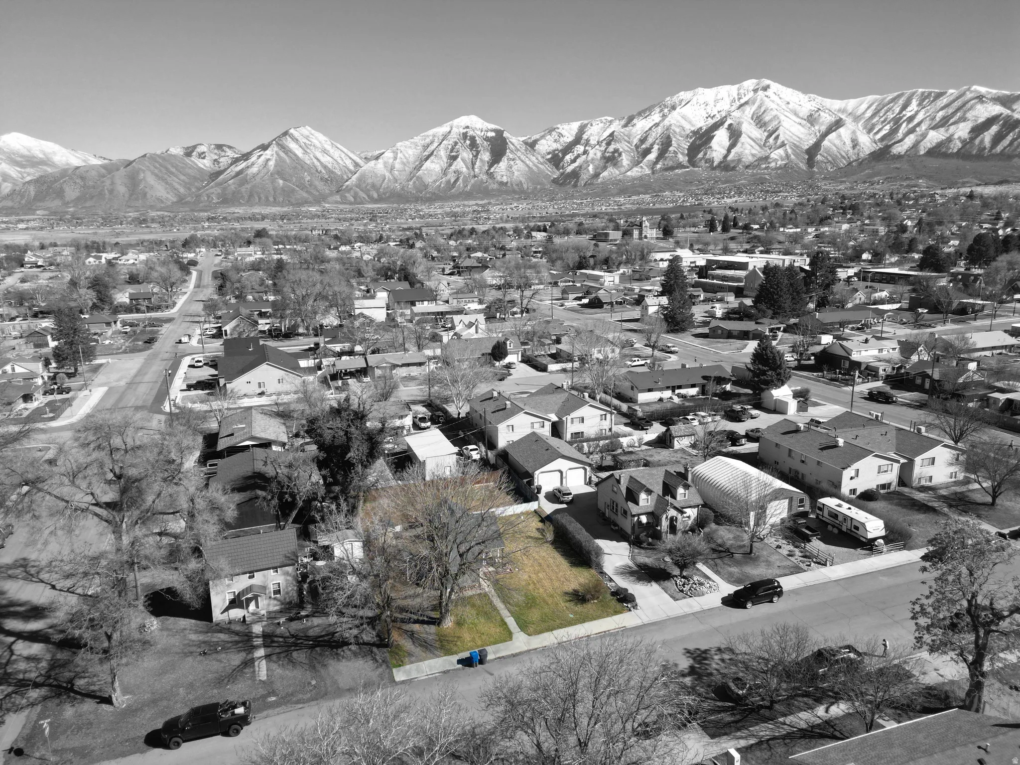 Aerial perspective of suburban area with a mountain backdrop