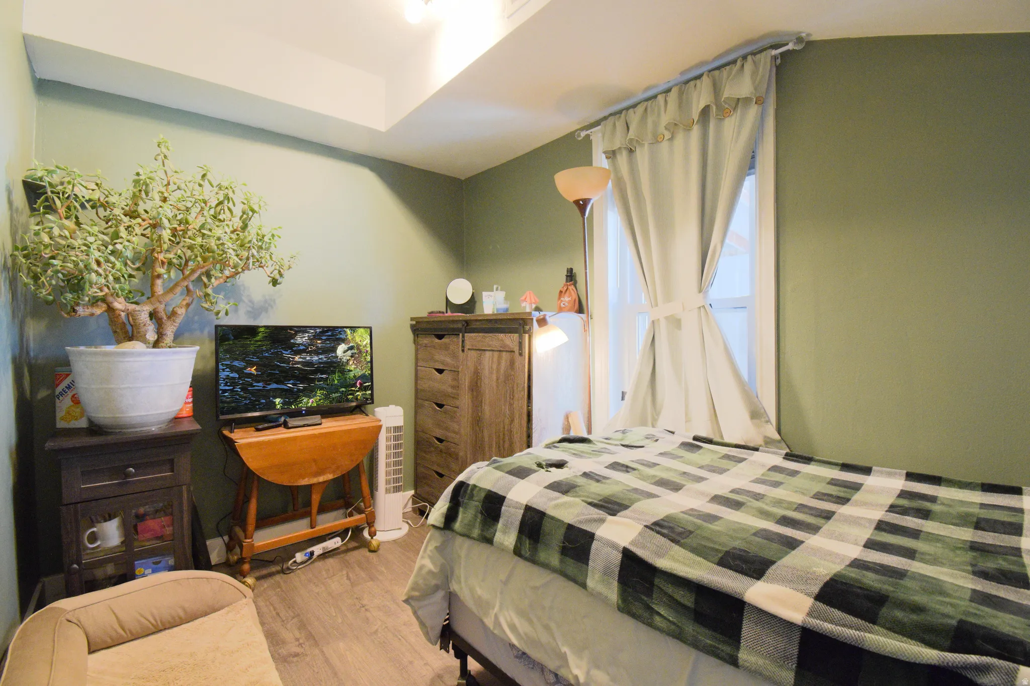 Bedroom with wood finished floors
