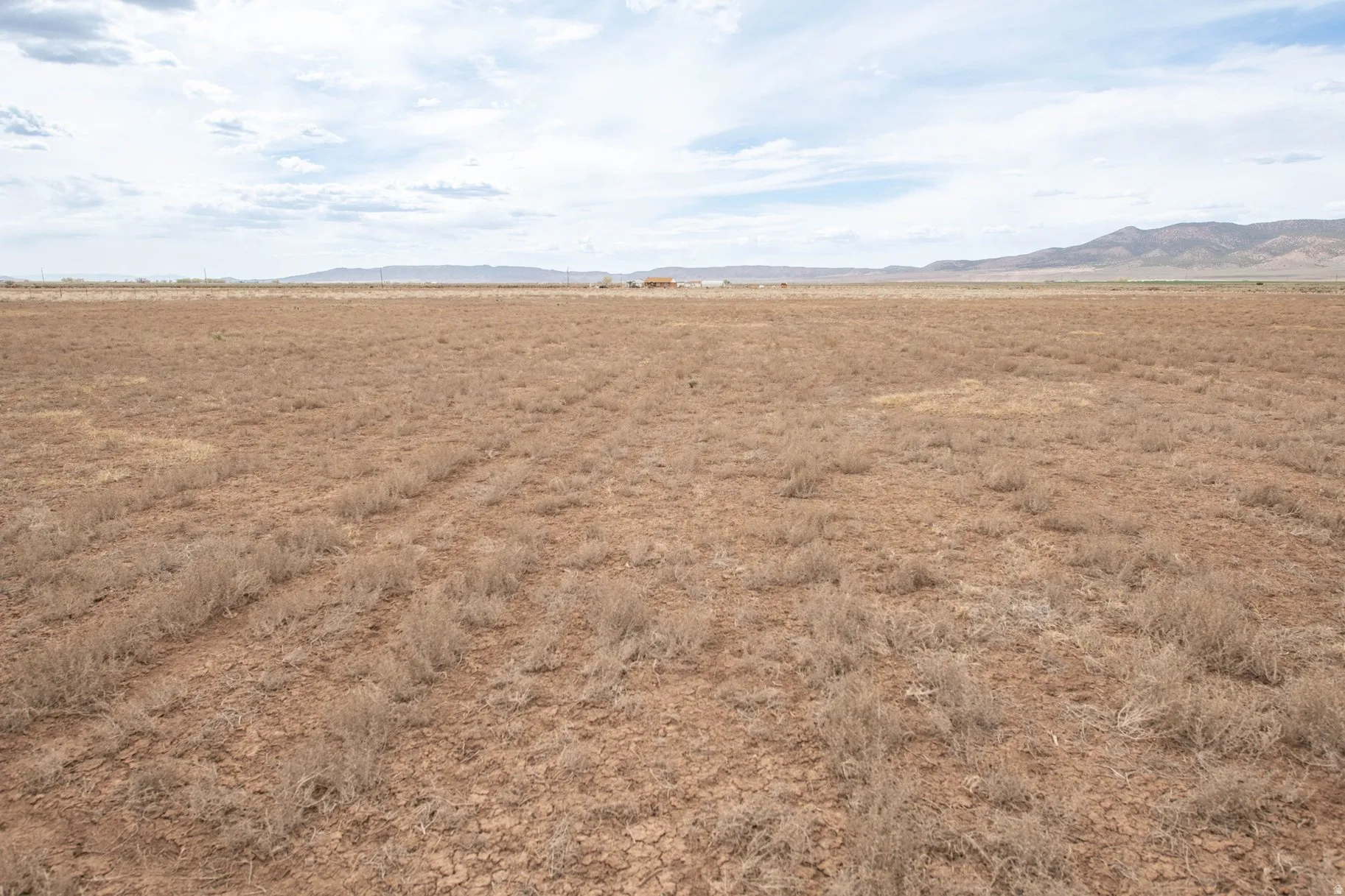 View of mountain background featuring rural landscape