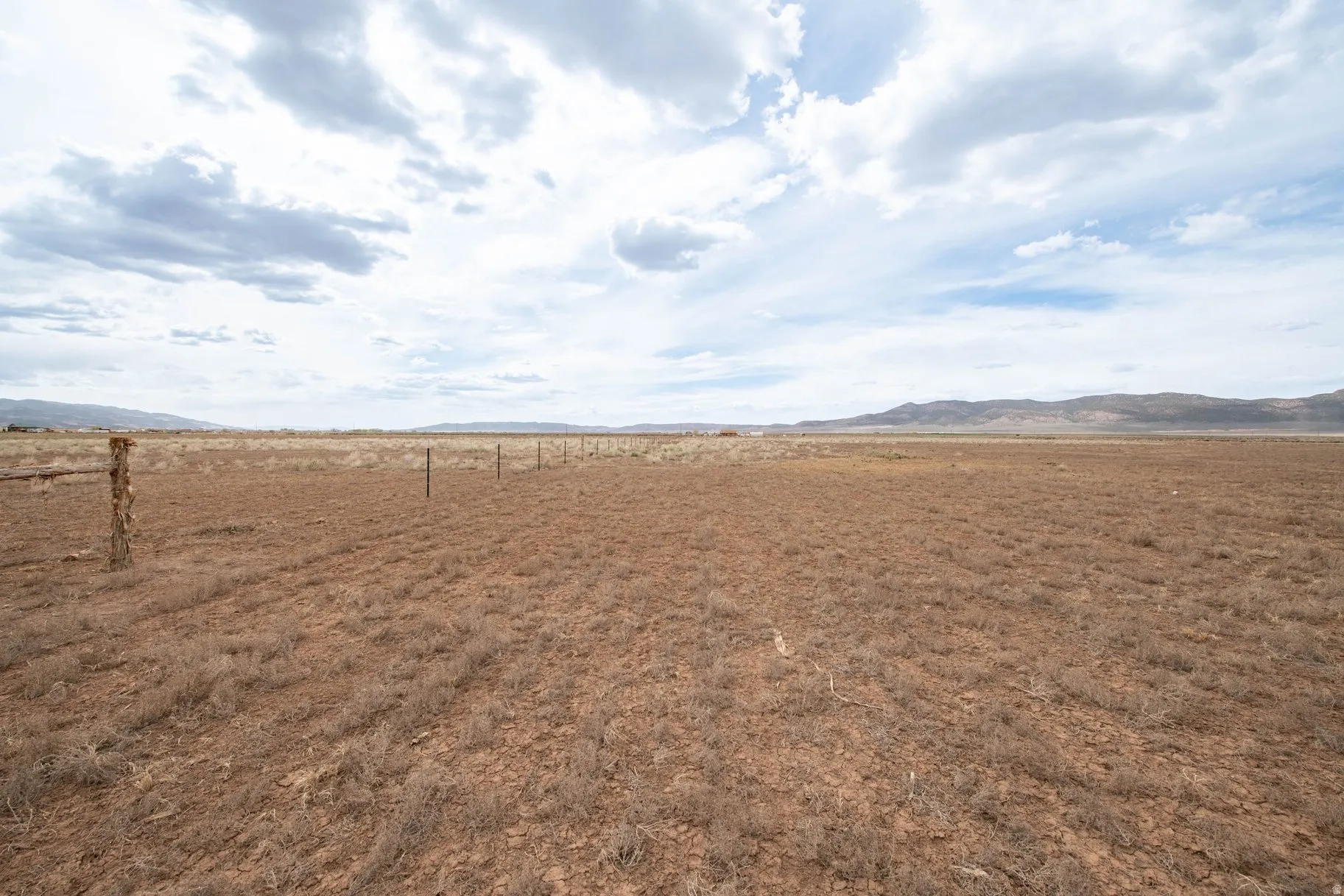 View of yard featuring a rural view and a mountain view