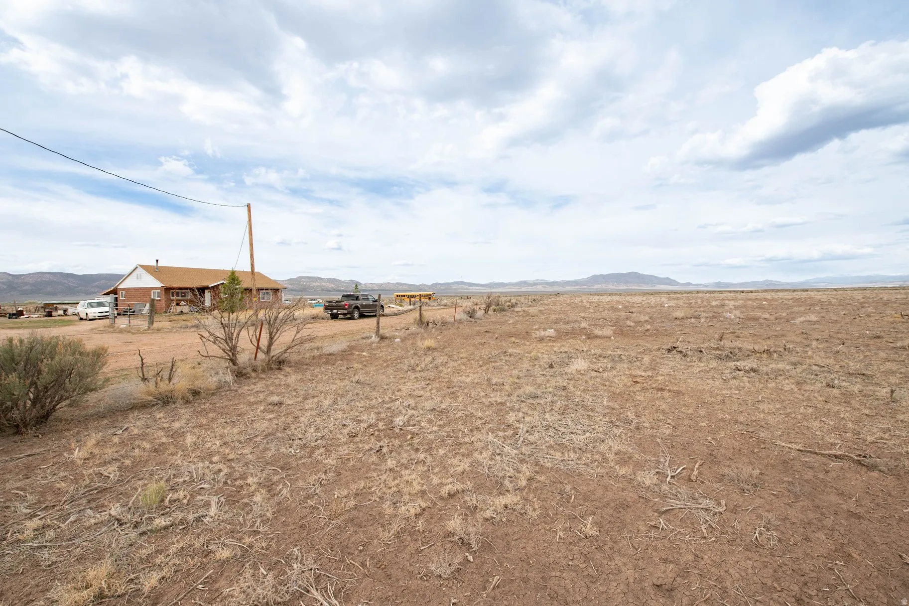 View of yard with a mountain view and a rural view
