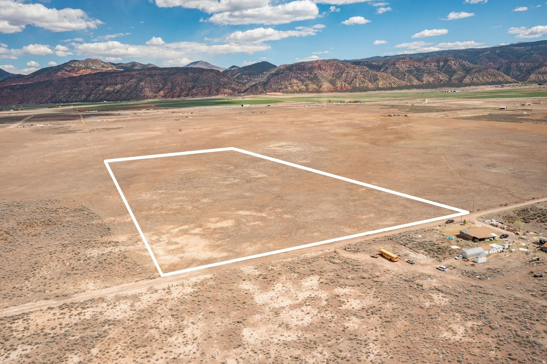 View of mountain backdrop with rural landscape