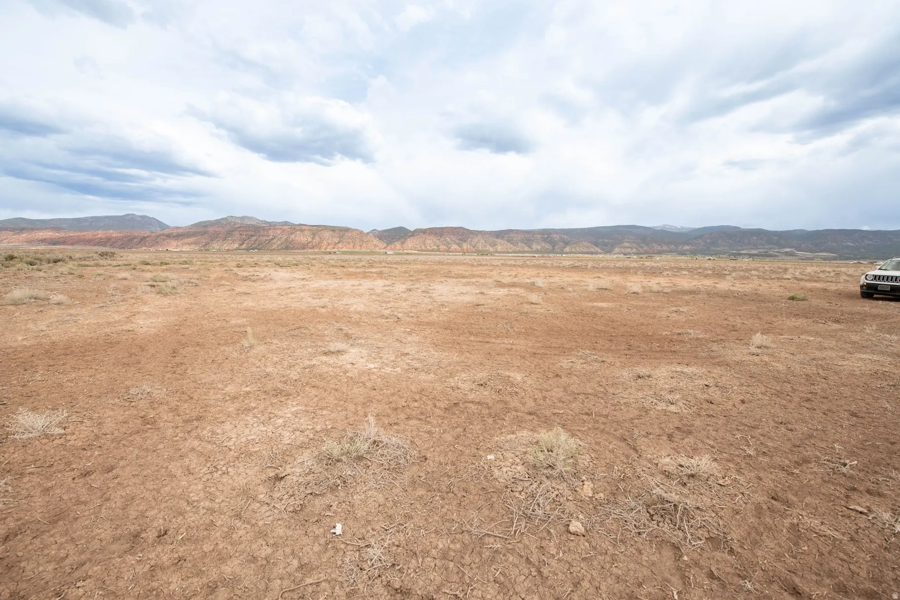 View of mountain background featuring rural landscape