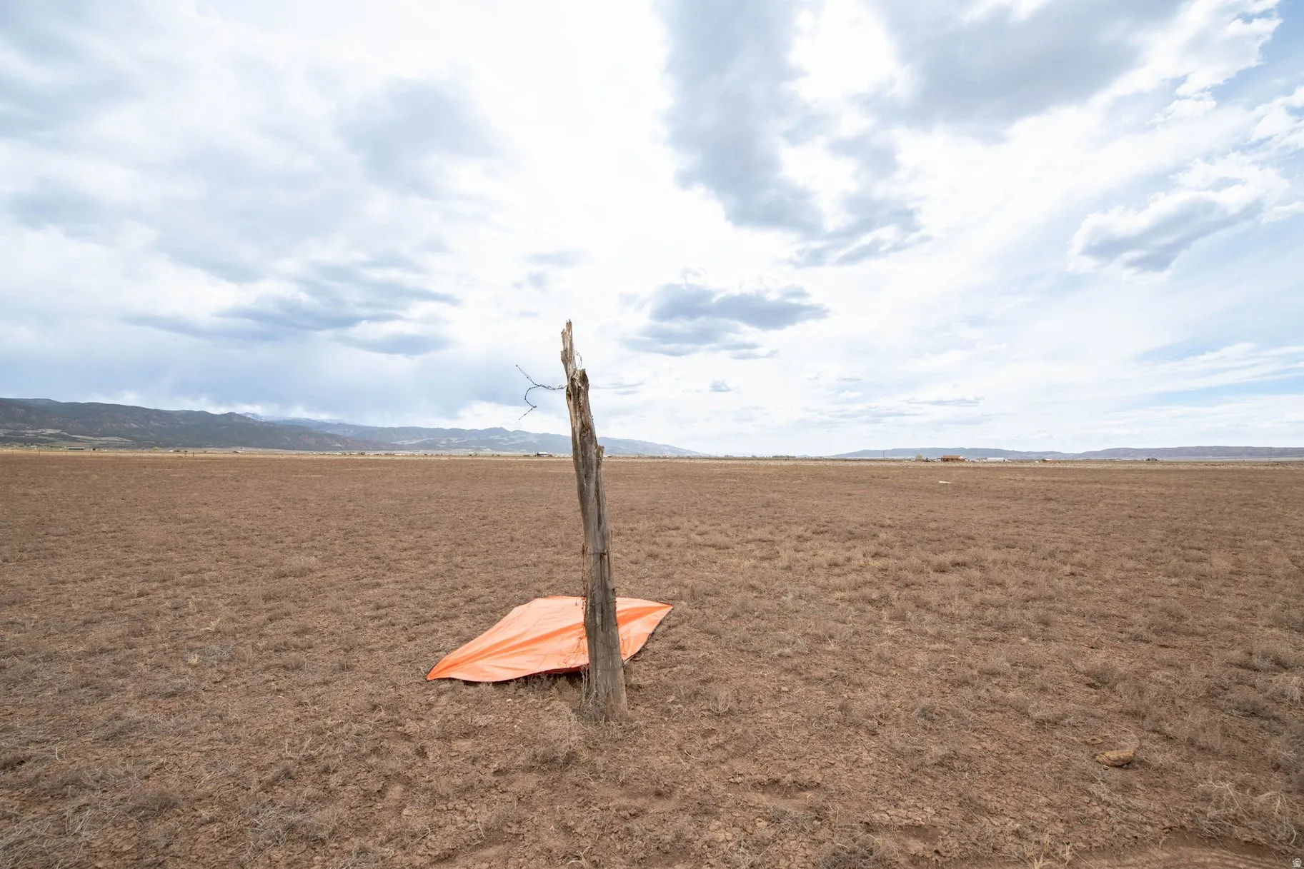 Surrounding community with a view of countryside and a mountain view