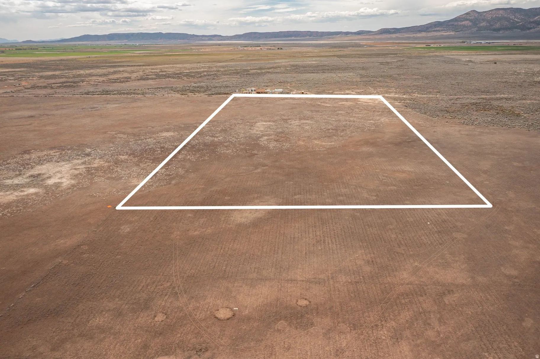 View of rural area featuring a mountainous background and property boundaries highlighted