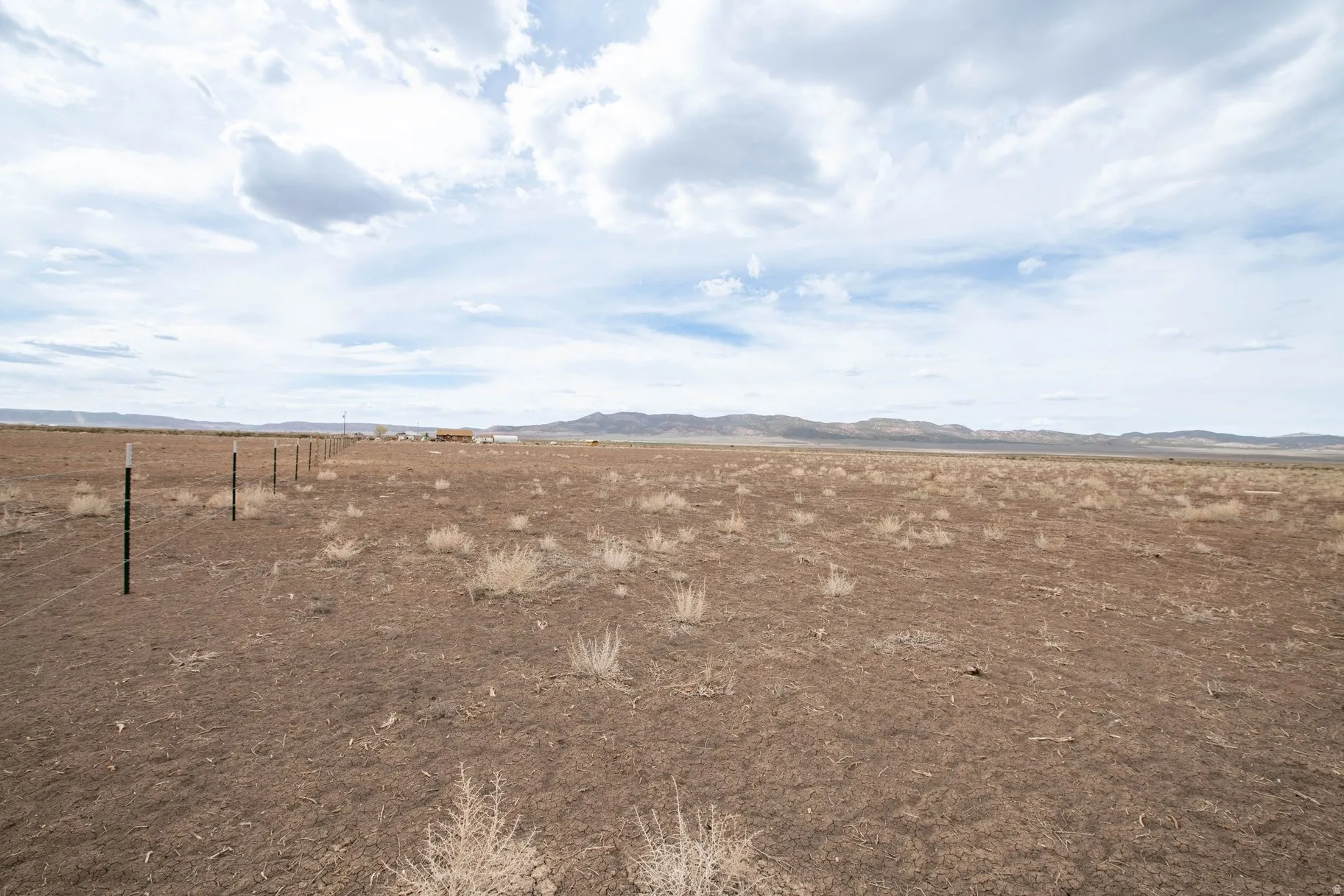 View of yard featuring a mountain view and a view of rural / pastoral area