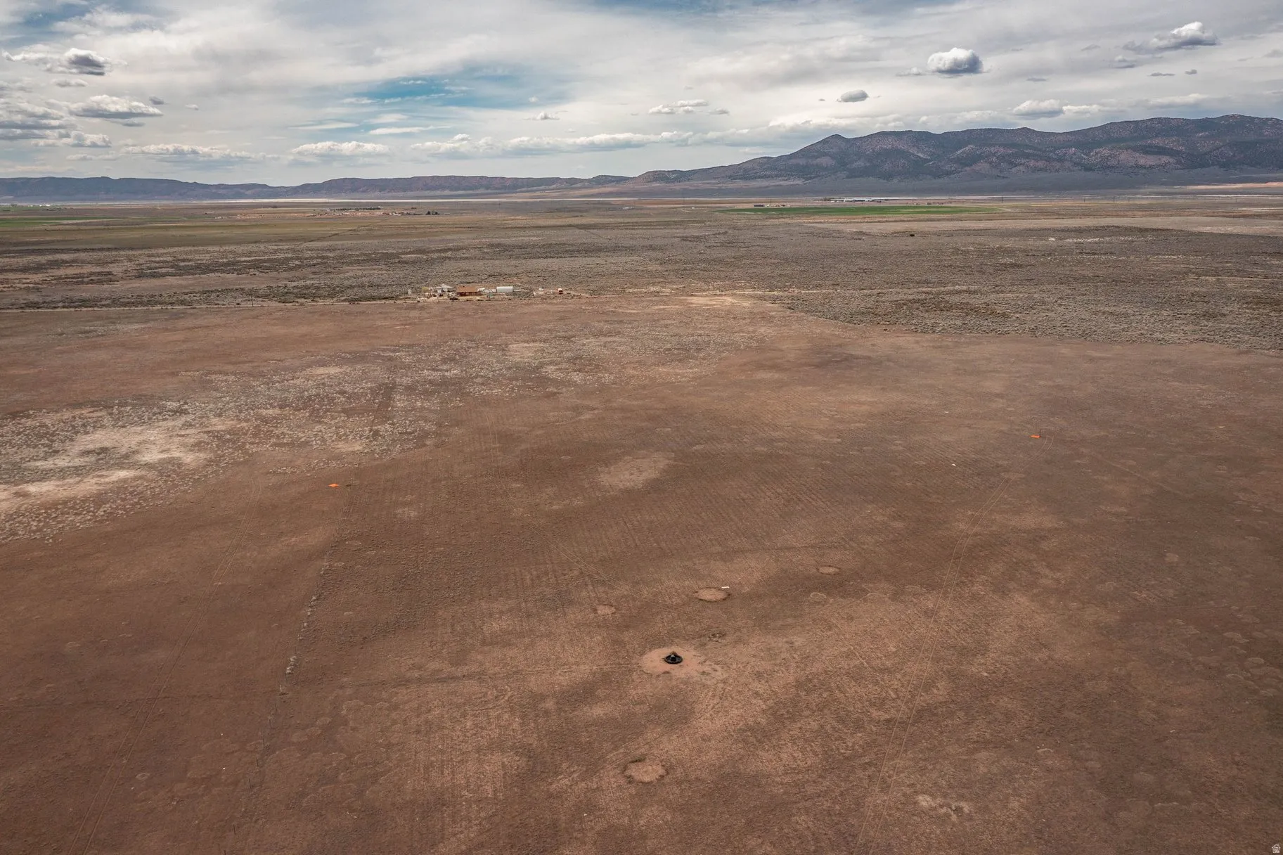 View of mountain backdrop featuring rural landscape