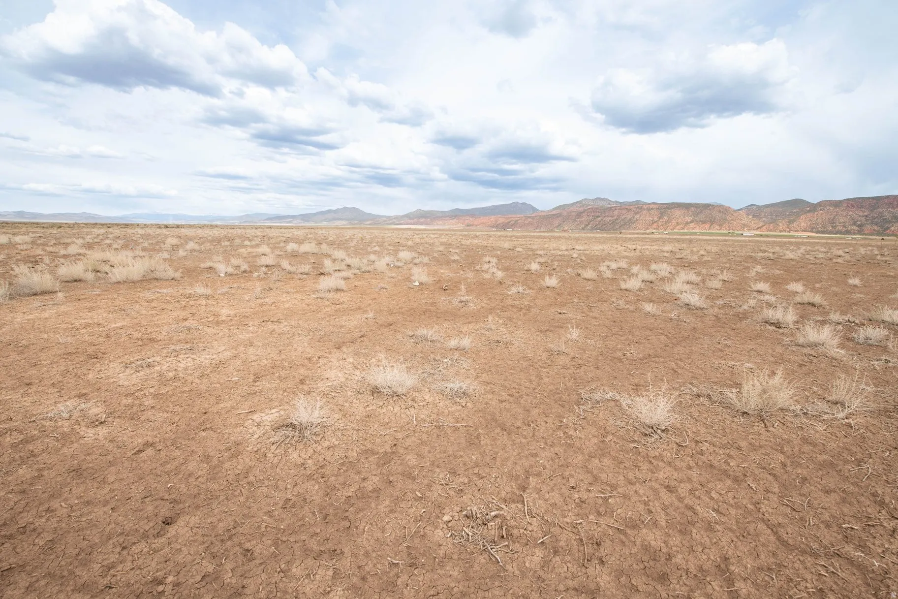 View of mountain background featuring rural landscape