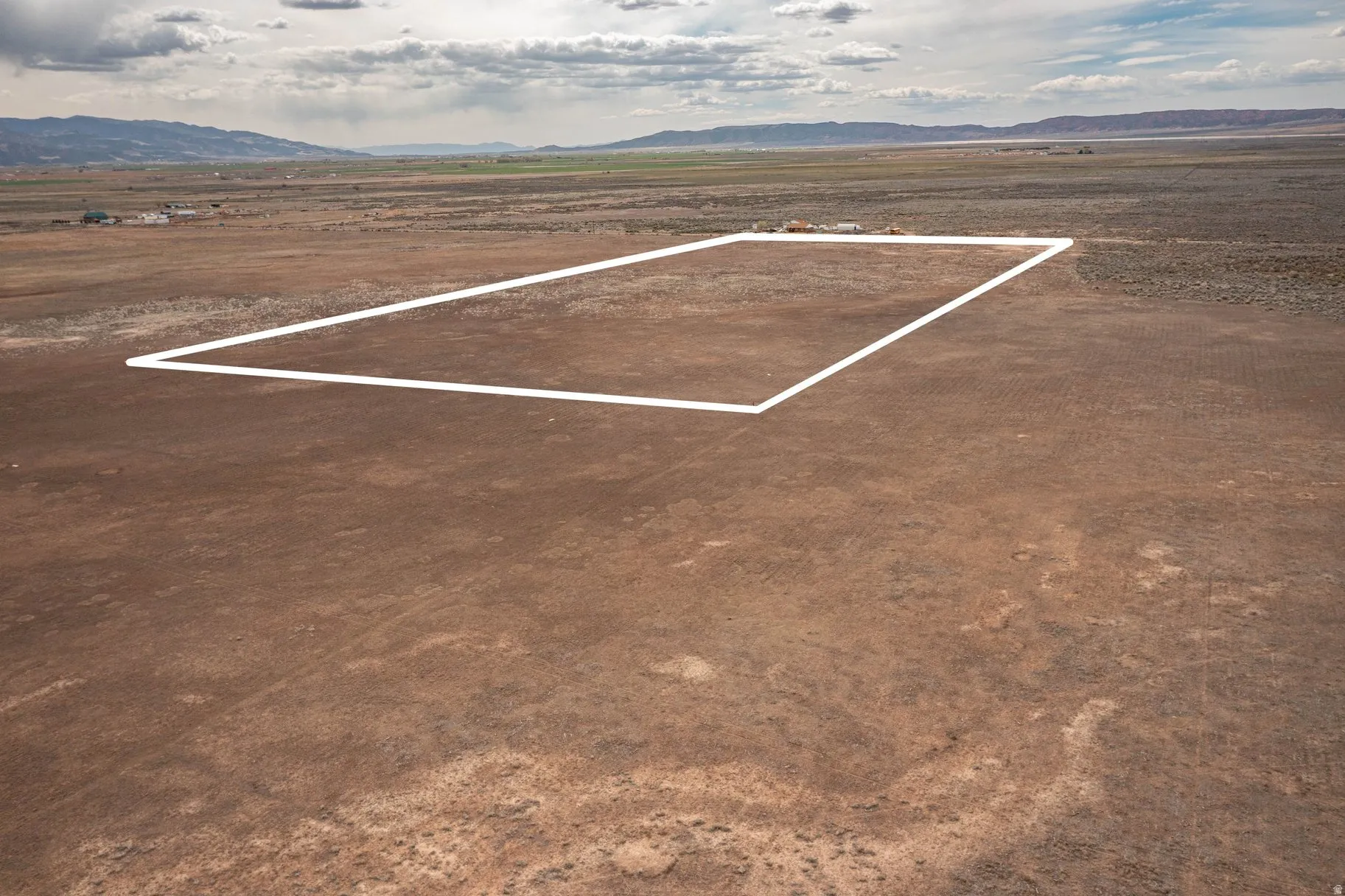 View of parking with a mountain view and a view of countryside