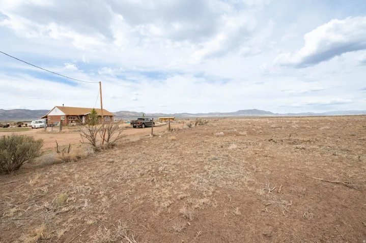 View of yard with a mountain view and a rural view