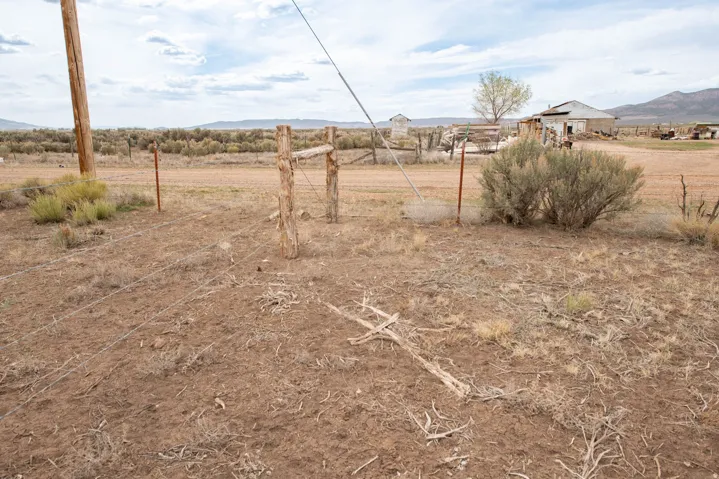 View of yard with a mountain view and a view of rural / pastoral area