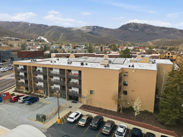 Drone / aerial view of mountains and apartment complex