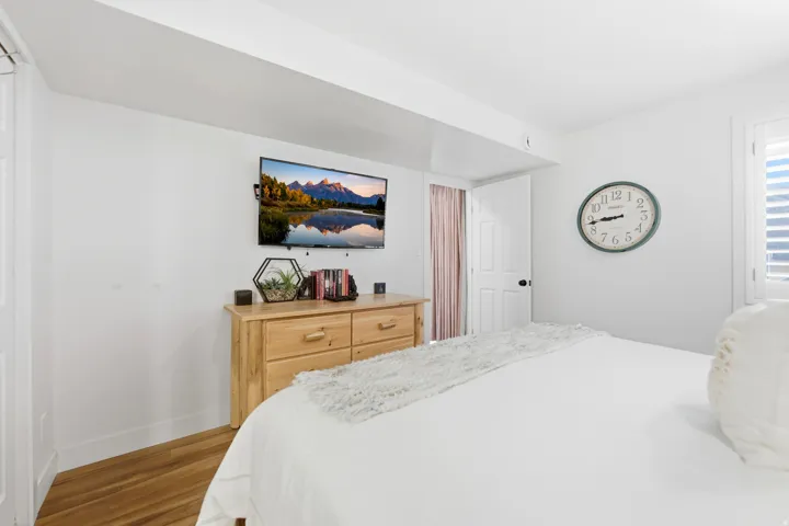 Bedroom featuring light wood finished floors and baseboards