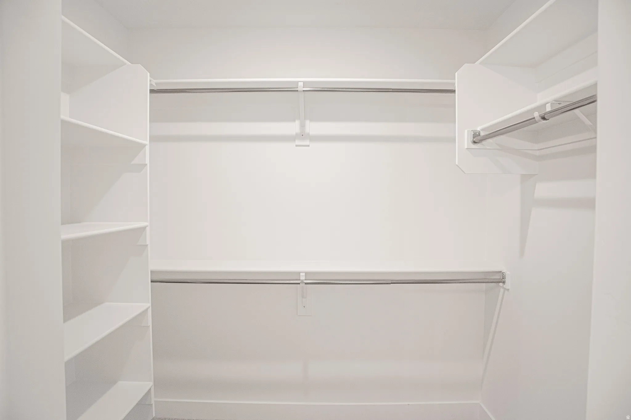 Large walk-in closet in primary suite.