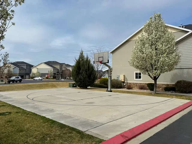 View of sport court featuring a residential view and community basketball court