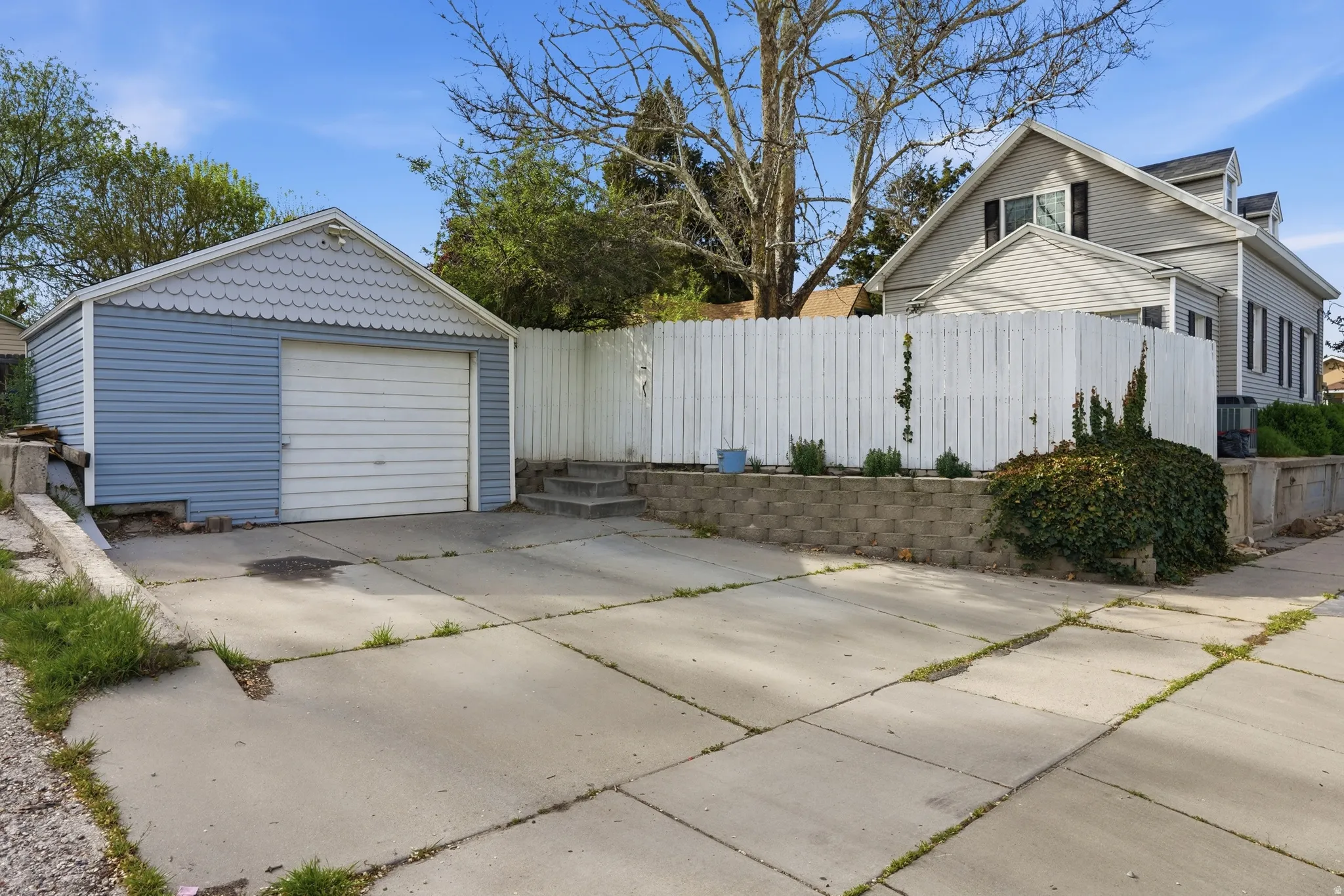Detached garage with concrete driveway