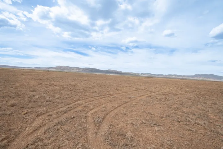 Aerial view of sparsely populated area with a mountainous background