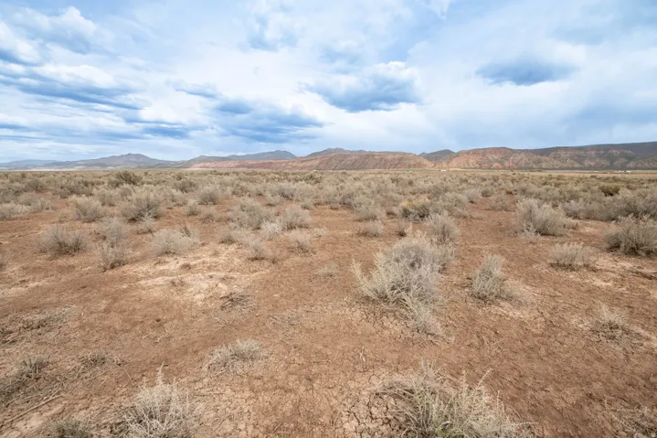 View of mountain backdrop with a desert landscape