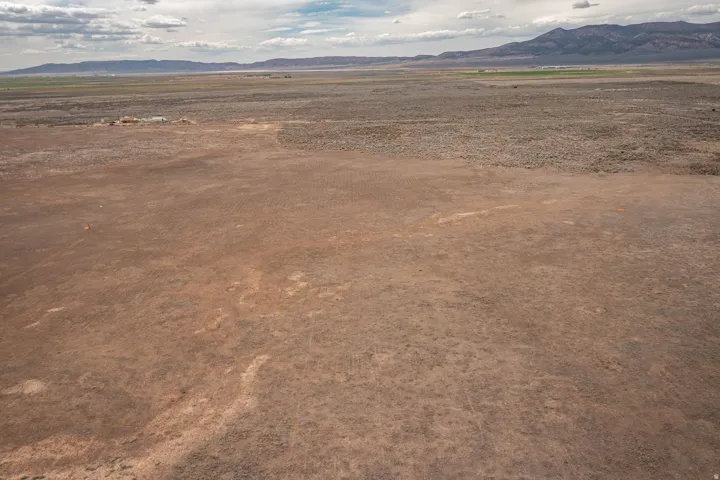 View of mountain backdrop featuring rural landscape and a desert landscape