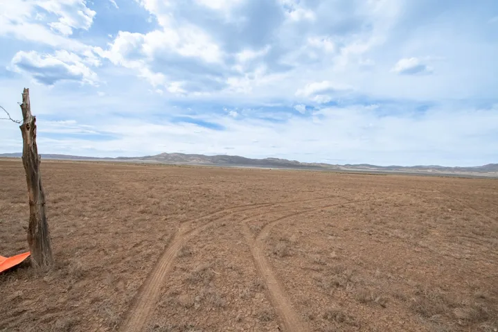 View of undeveloped land with rural landscape and a mountain backdrop