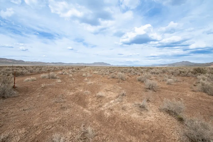 View of mountain backdrop with a desert landscape and rural landscape