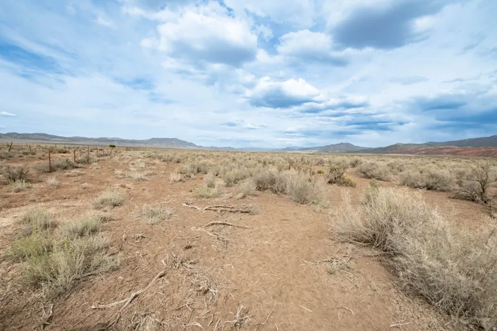 View of mountain backdrop featuring a desert landscape and rural landscape