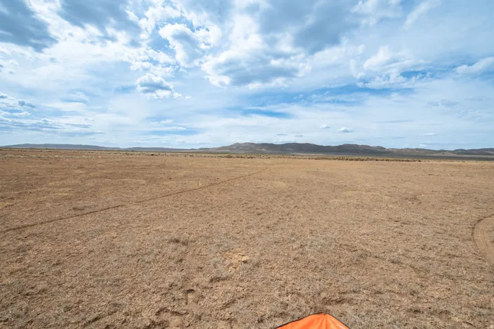 View of yard with a mountain view, a view of rural / pastoral area, and a desert view