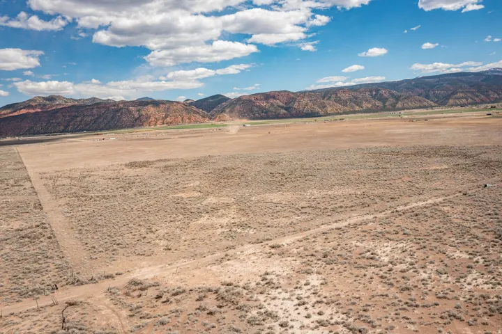 View of mountain background featuring rural landscape
