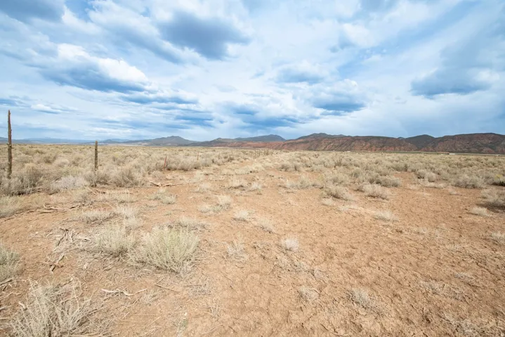 View of mountain backdrop featuring a desert landscape
