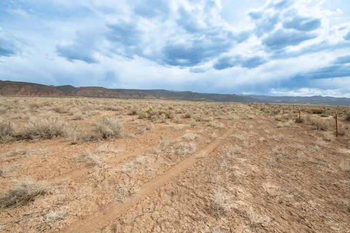 View of mountain backdrop featuring a desert landscape and rural landscape