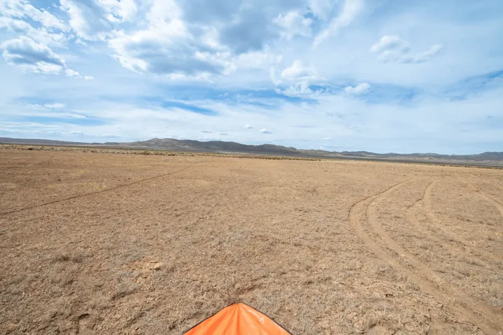 View of yard with a mountain view, a view of rural / pastoral area, and view of desert
