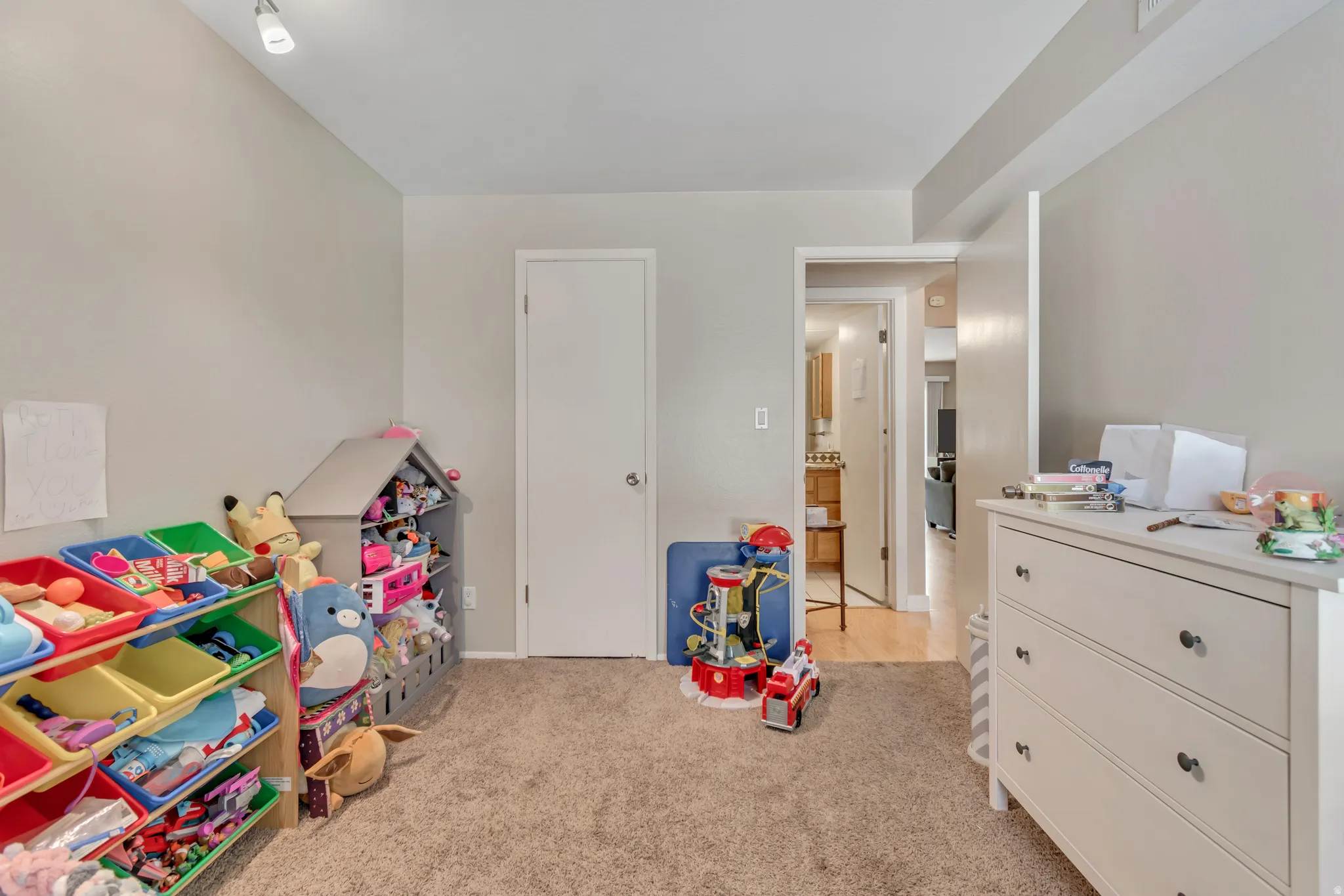 Recreation room featuring light carpet