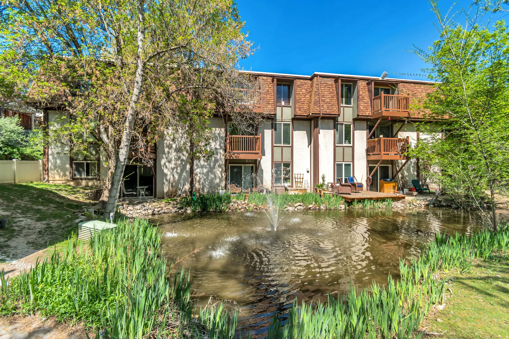 View of apartment building / complex featuring a water view