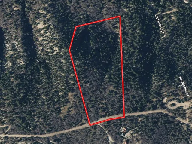 Aerial map of property and surrounding area with property boundaries highlighted