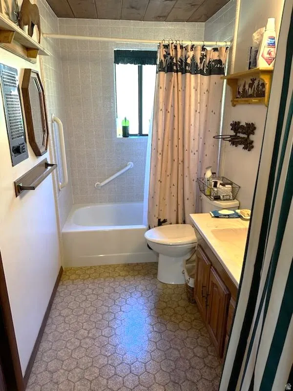 Bathroom featuring vanity and shower / tub combo