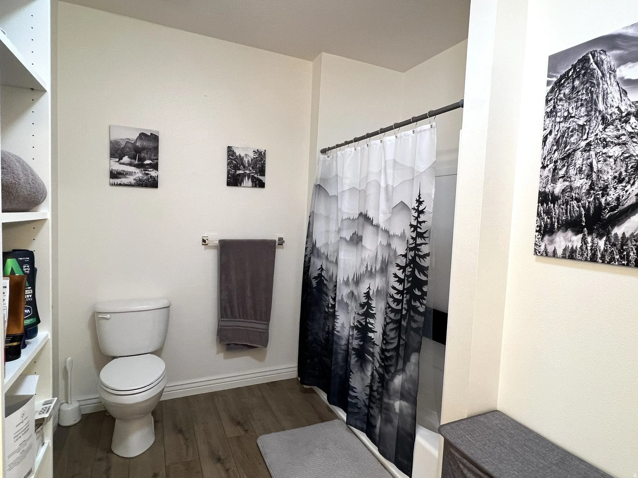 Bathroom featuring a shower with shower curtain and dark wood finished floors