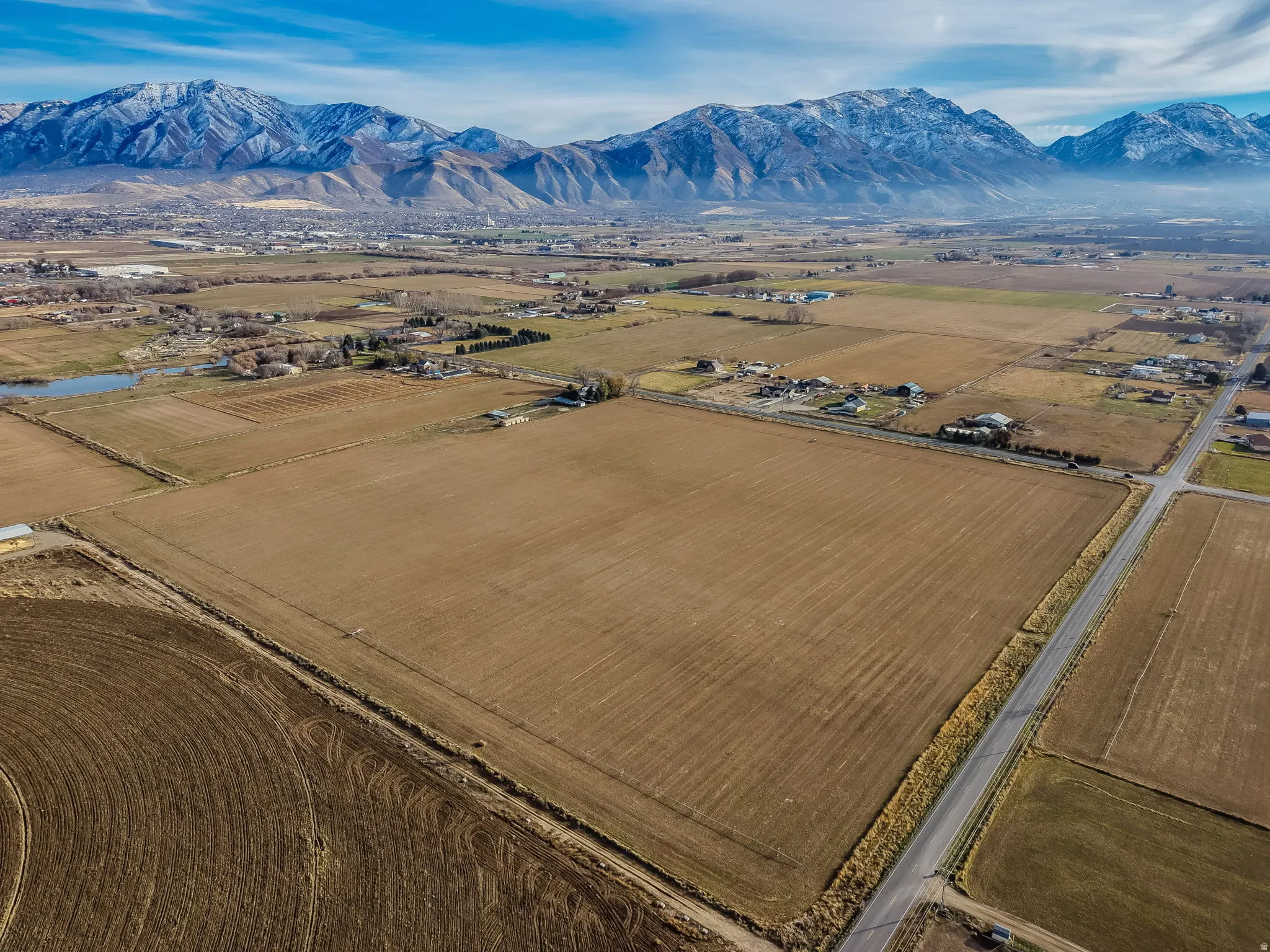 View of rural area featuring mountains and abundant farmland