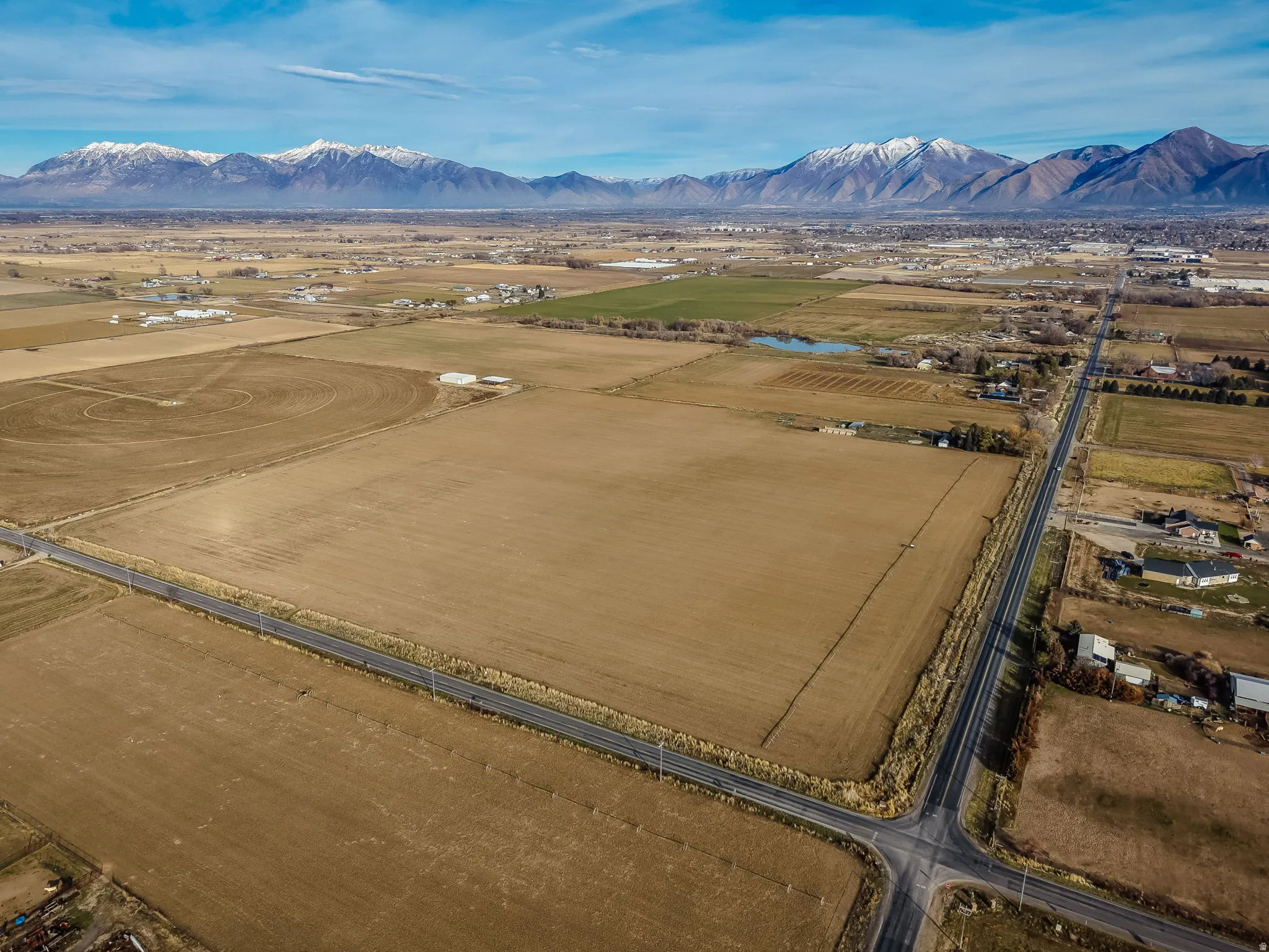 Overview of rural landscape featuring a mountain backdrop