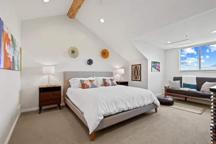 Carpeted bedroom featuring recessed lighting and beam ceiling