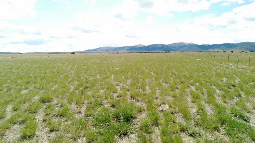 View of mountain backdrop featuring rural landscape