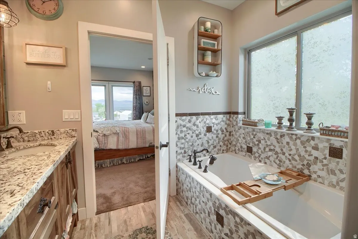 Full bath with vanity, a garden tub