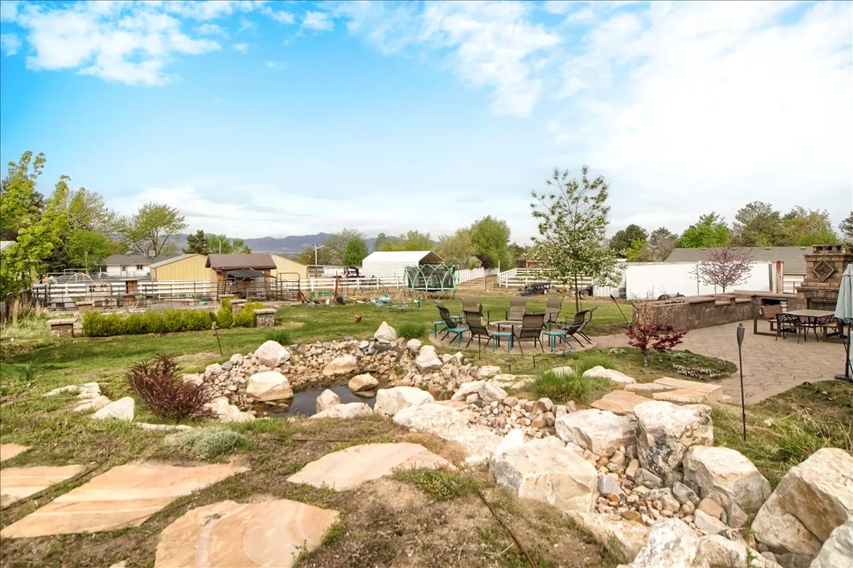 View of yard featuring a patio area and outdoor dining area