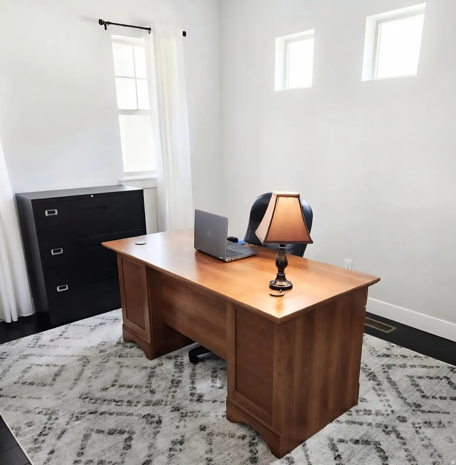 Office space with baseboards and wood finished floors