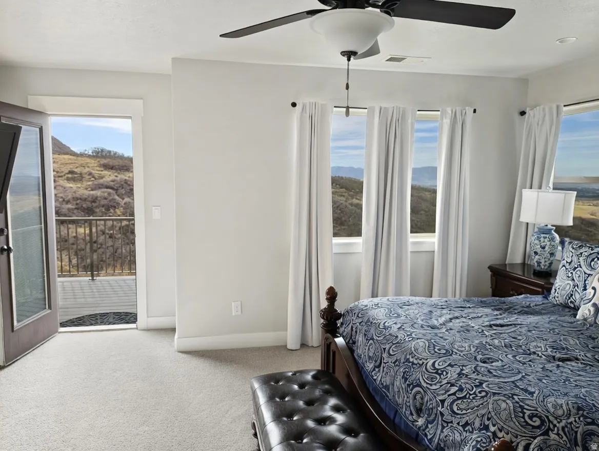 Interior room with light gray wall paint and matching carpet