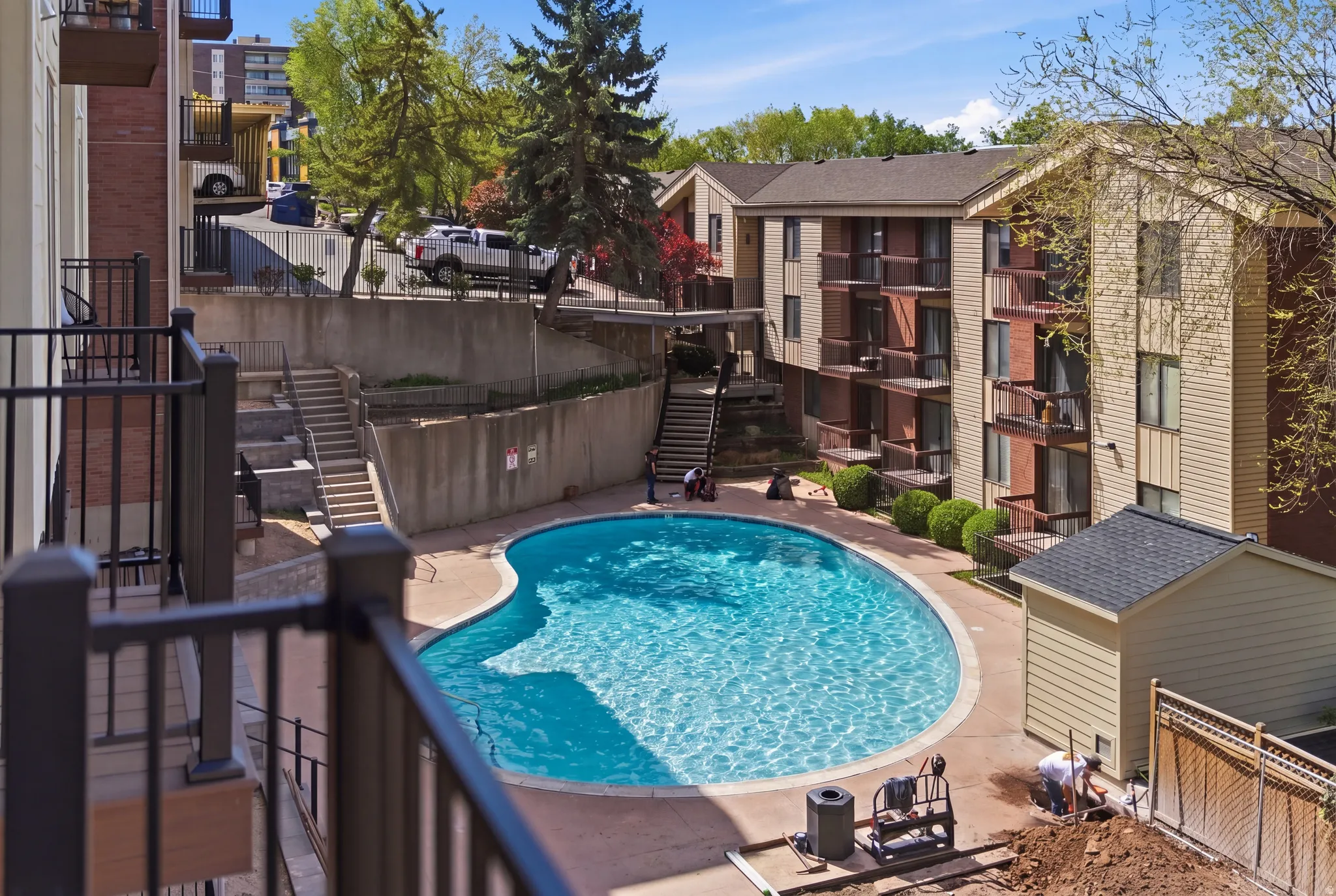 Community pool featuring large lounging area
