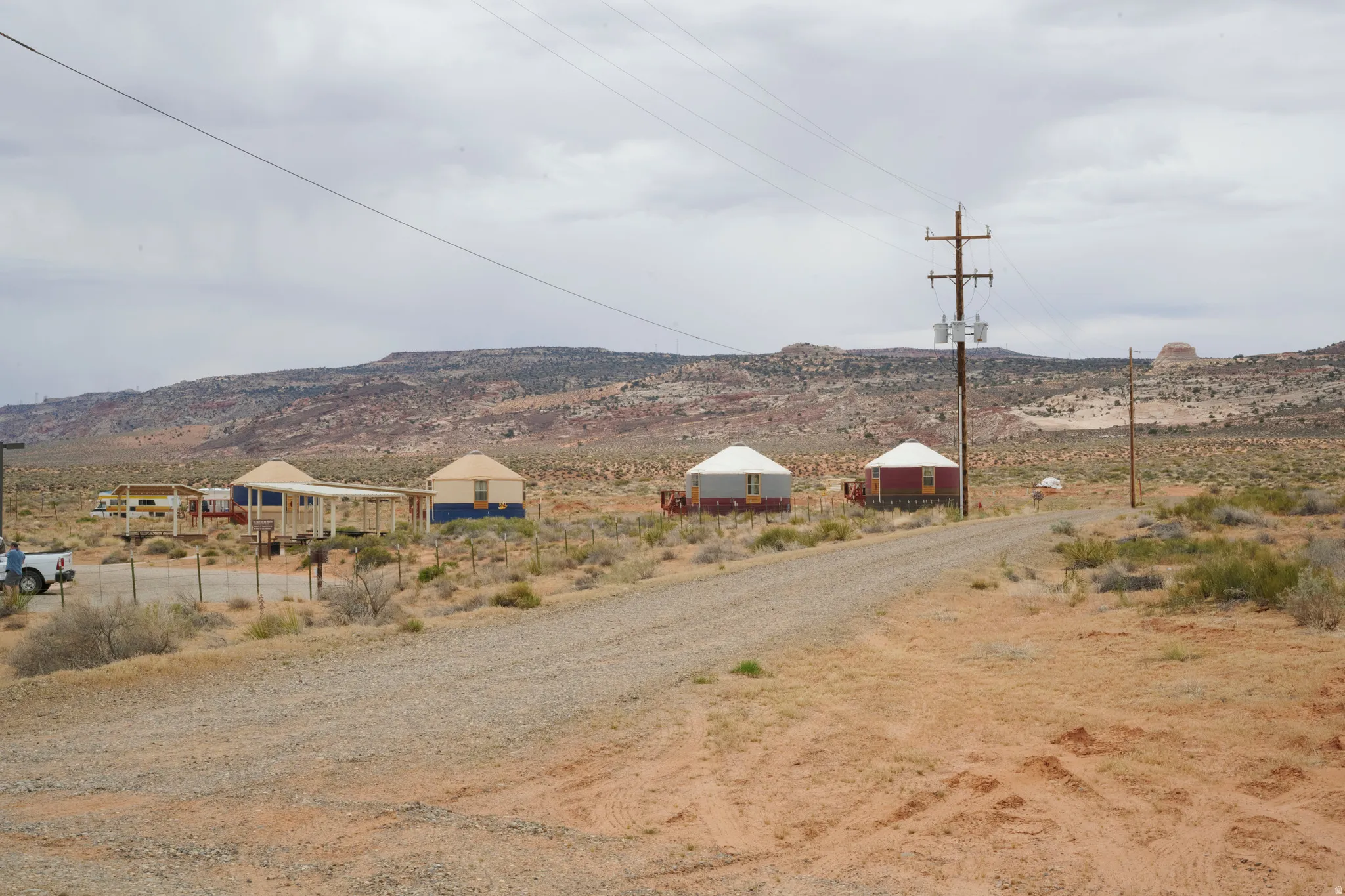 View of mountain backdrop with rural landscape