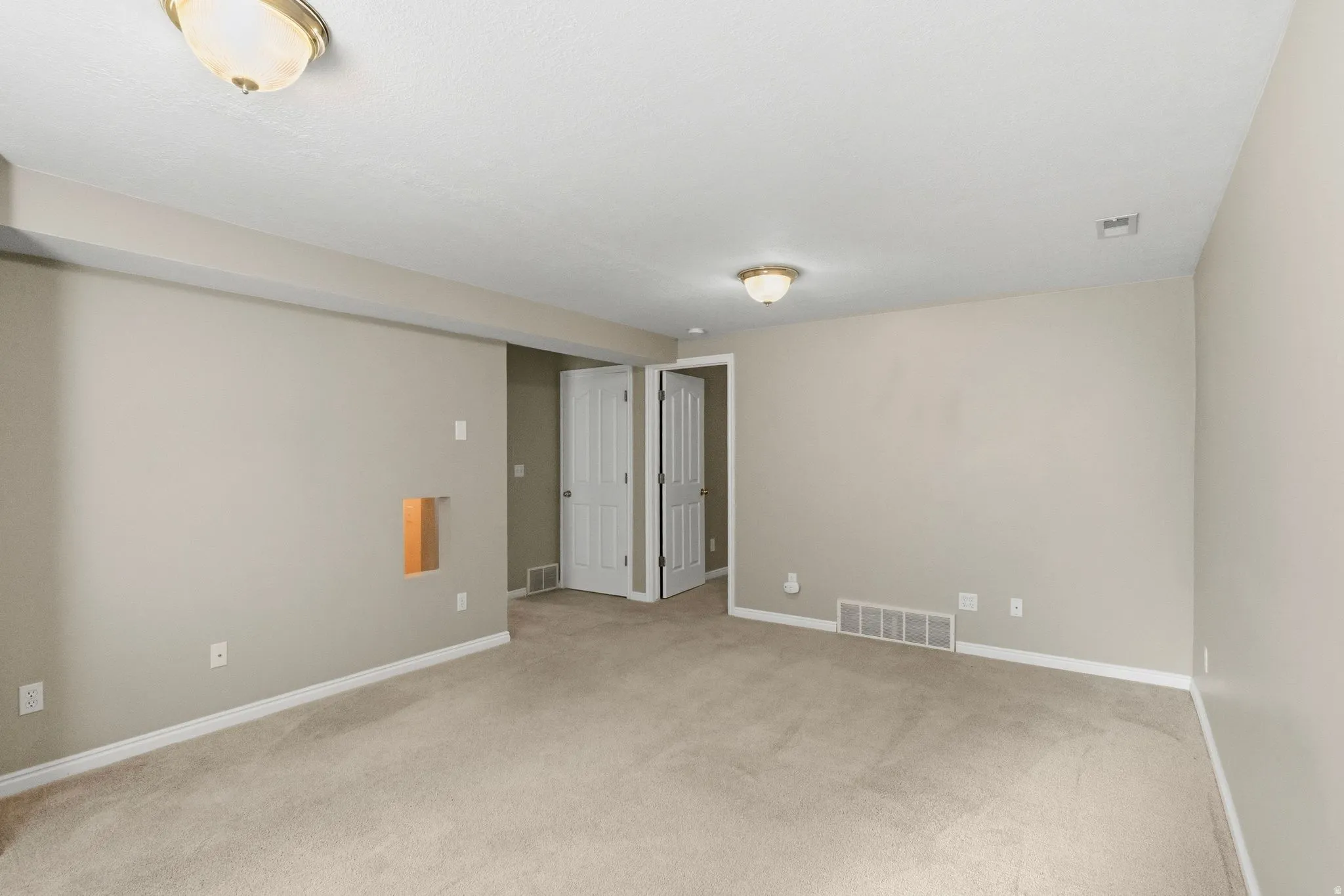 Basement family room view from corner.