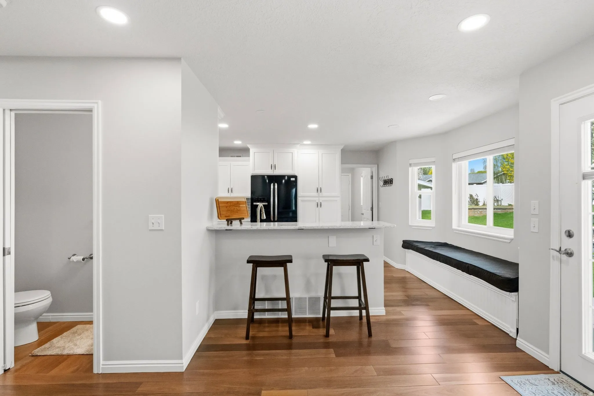 View of kitchen breakfast bar from family room.